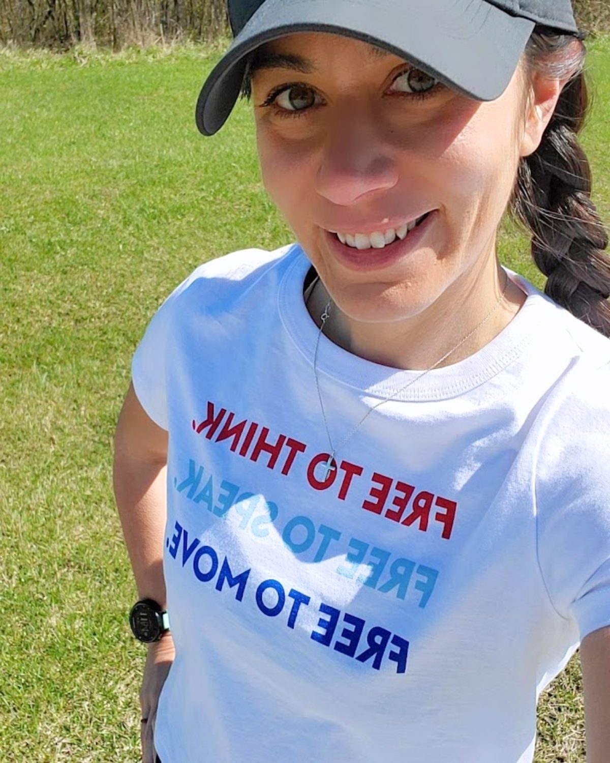 Amy, founder of The Faithfully Fit Method, outside on a spring day